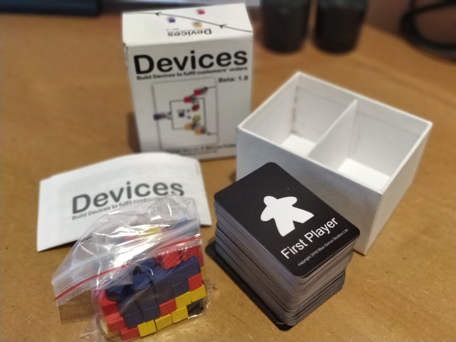 Prototype board game product with box, rule sheet and components