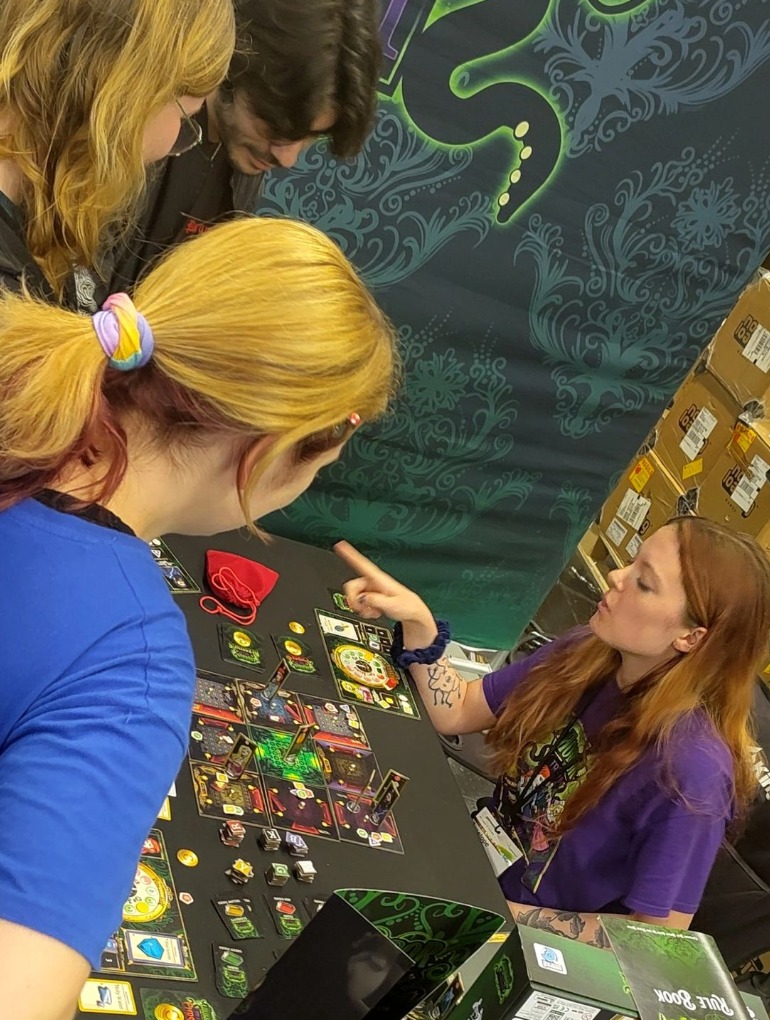 Live gameplay demo taking place at an exhibition stand