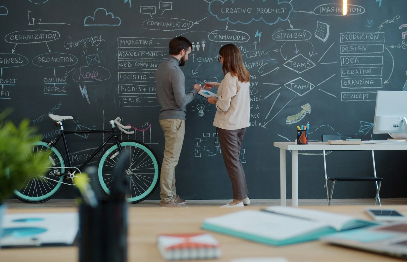 Team planning startup growth strategy in a collaborative workspace