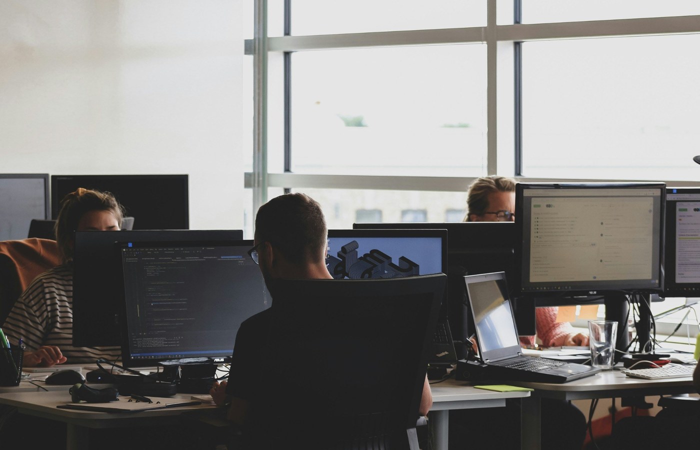 Software development team reviewing digital service architecture